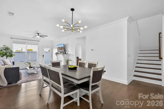 a bathroom with a double vanity sink mirror and bathtub