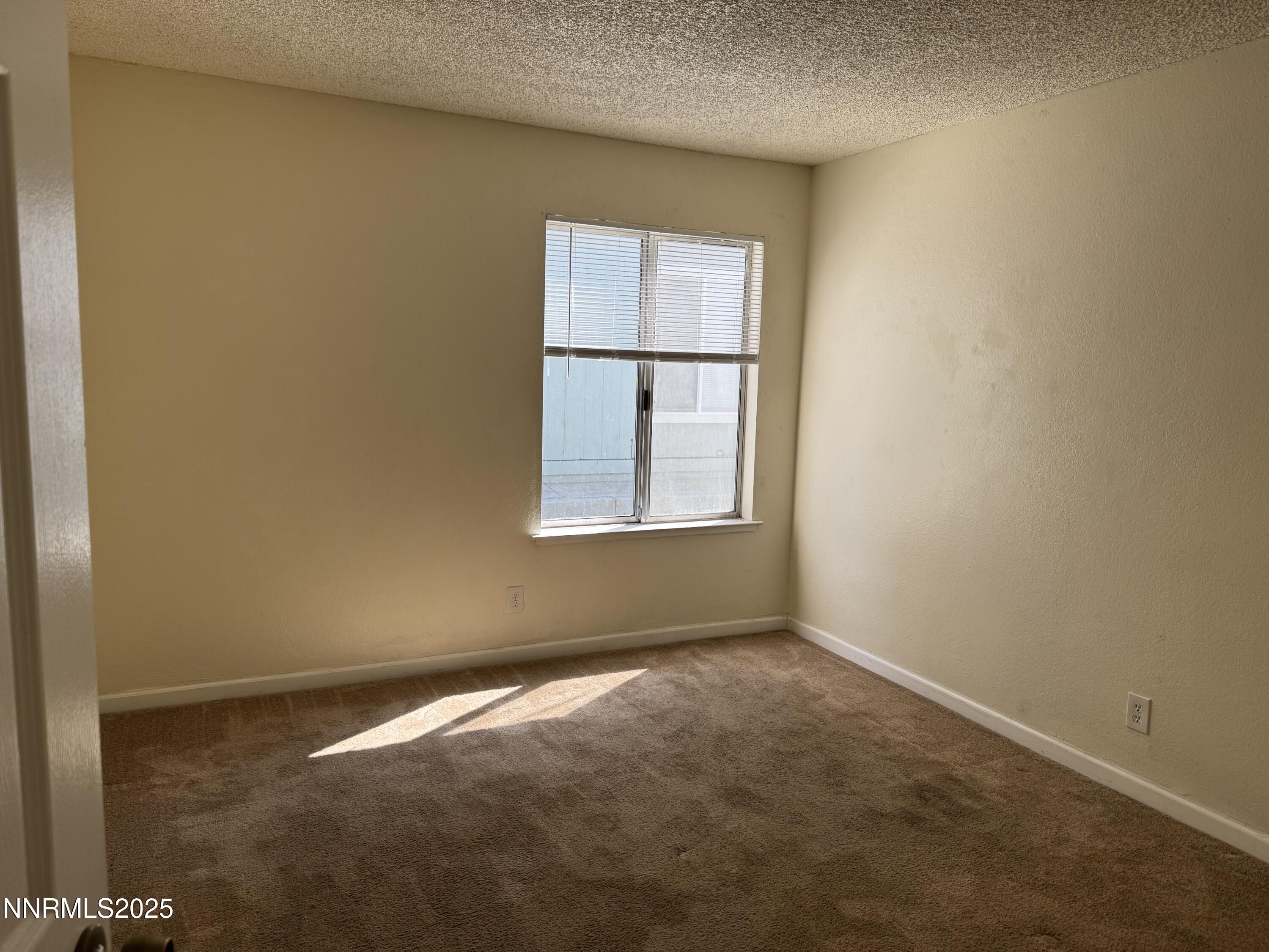 4600 Neil Road, Unit 33 Reno, NV 89502 - Photo 12 of 13 an empty room with a window