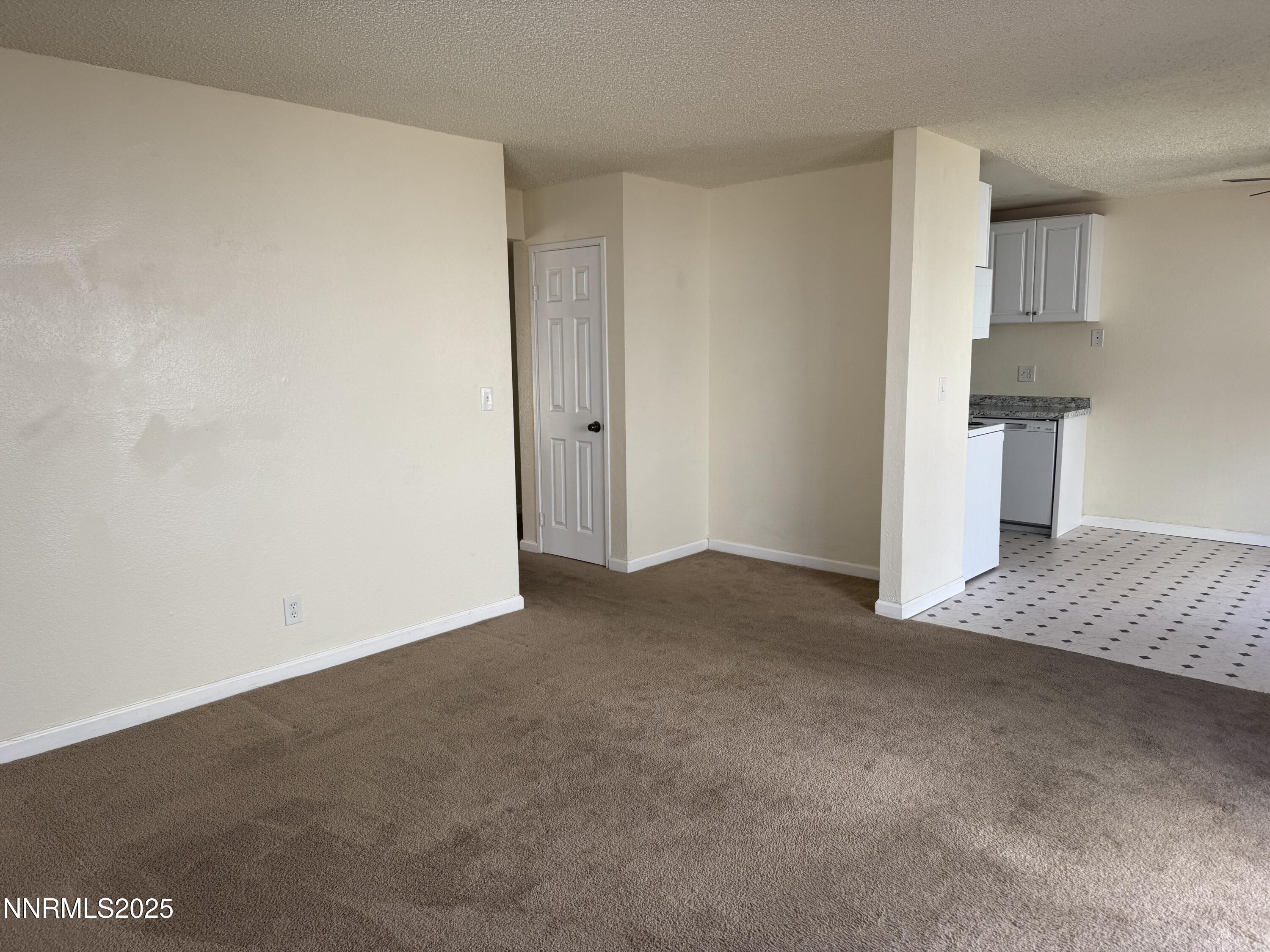 4600 Neil Road, Unit 33 Reno, NV 89502 - Photo 6 of 13 a view of an empty room and kitchen