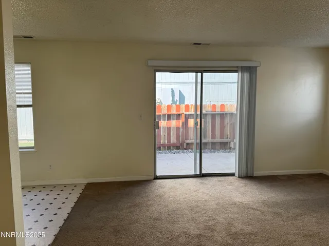 a view of a room with sliding glass door
