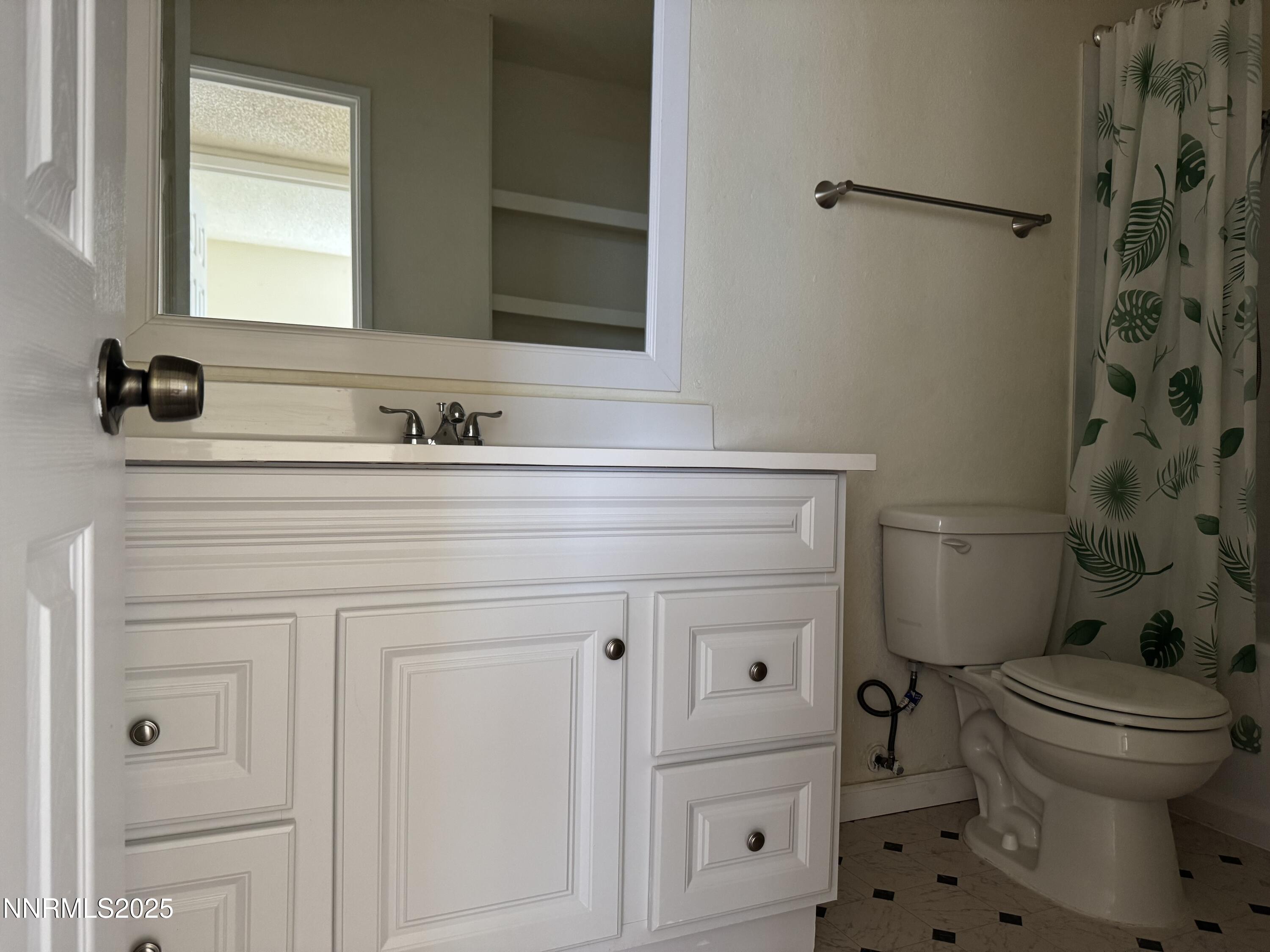 4600 Neil Road, Unit 33 Reno, NV 89502 - Photo 9 of 13 a bathroom with a sink a toilet and shower