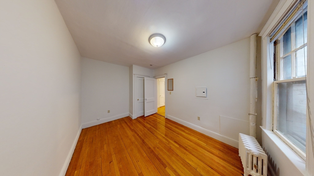32 Sidlaw Road, Unit 7 Boston, MA 02135 - Photo 7 of 10 a view of empty room with wooden floor