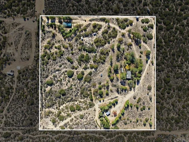 a view of a backyard of the house