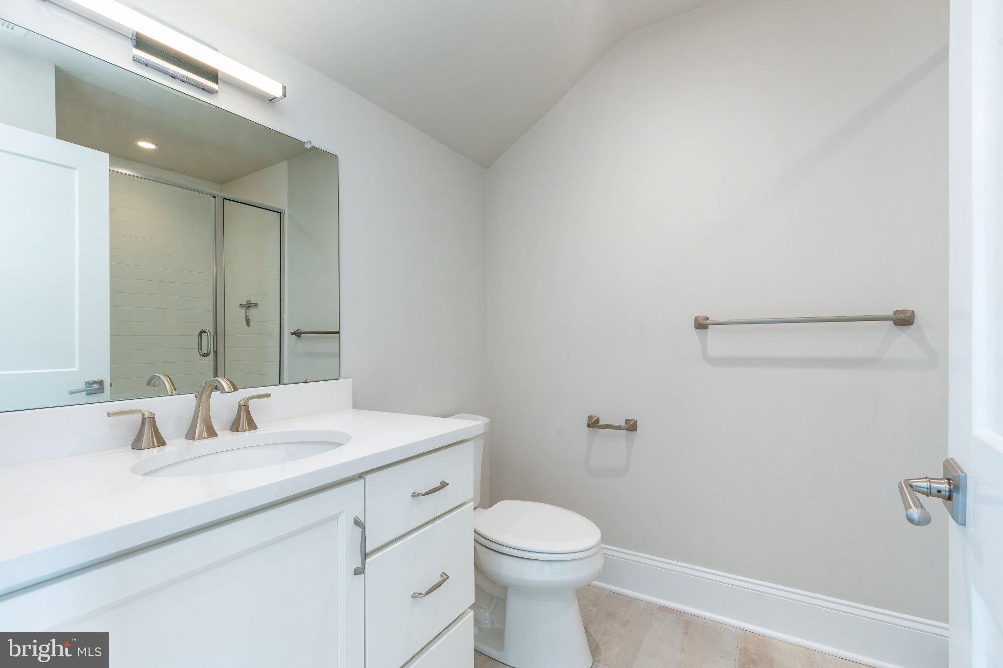 206 North Aberdeen Avenue, Unit D Wayne, PA 19087 - Photo 22 of 36 Sleek modern bathroom with clean lines.