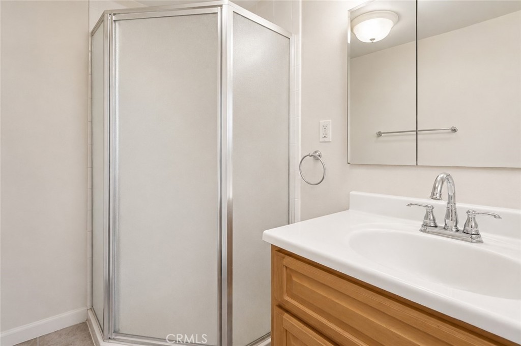 2209 Queensberry Road Pasadena, CA 91104 - Photo 26 of 44 a bathroom with a sink and a mirror