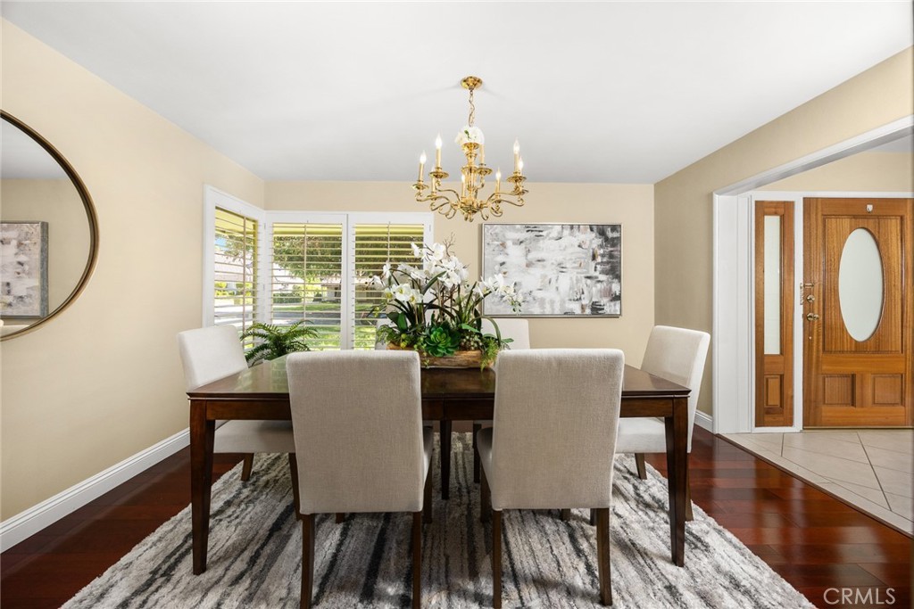 1439 Wembley Road San Marino, CA 91108 - Photo 4 of 45 a dining room with furniture a window and wooden floor