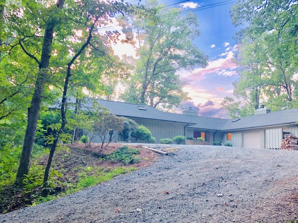 509 Horseshoe Curve Road Tryon, NC 28782 - Photo 14 of 28 a front view of a house with a garden