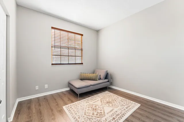 a bathroom with a toilet a sink a mirror a bathtub and vanity