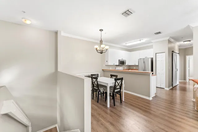 a view of a kitchen and dining room