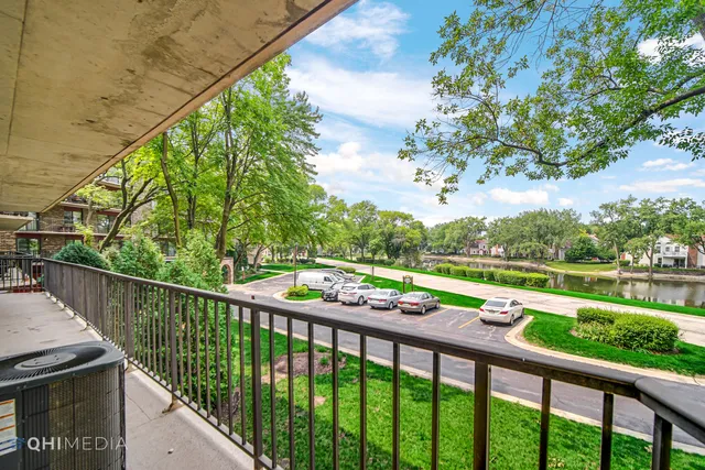 a view of a balcony with wooden floor