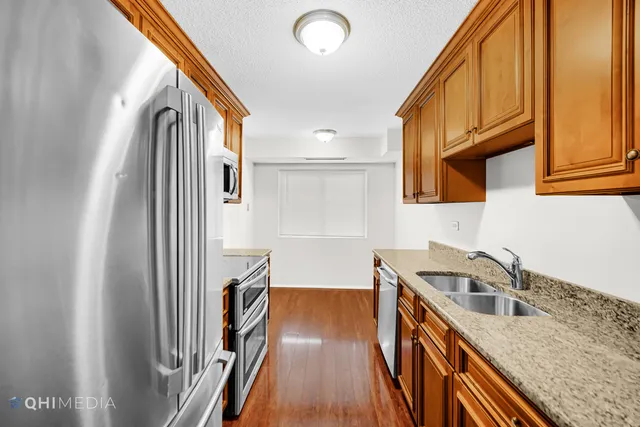 a view of a kitchen with a sink and cabinets