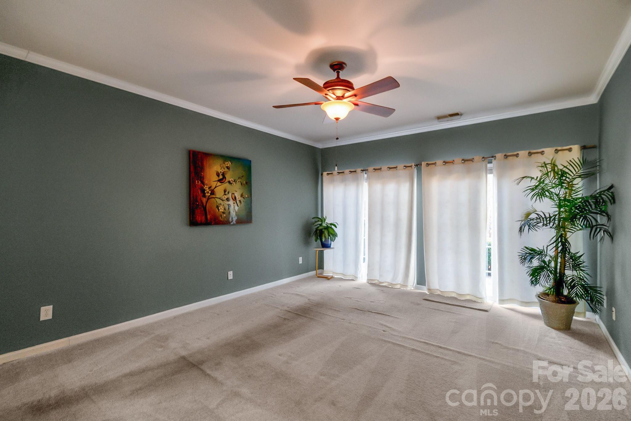 3037 Azalea Drive Fort Mill, SC 29707 - Photo 11 of 24 a view of a livingroom with a ceiling fan and window