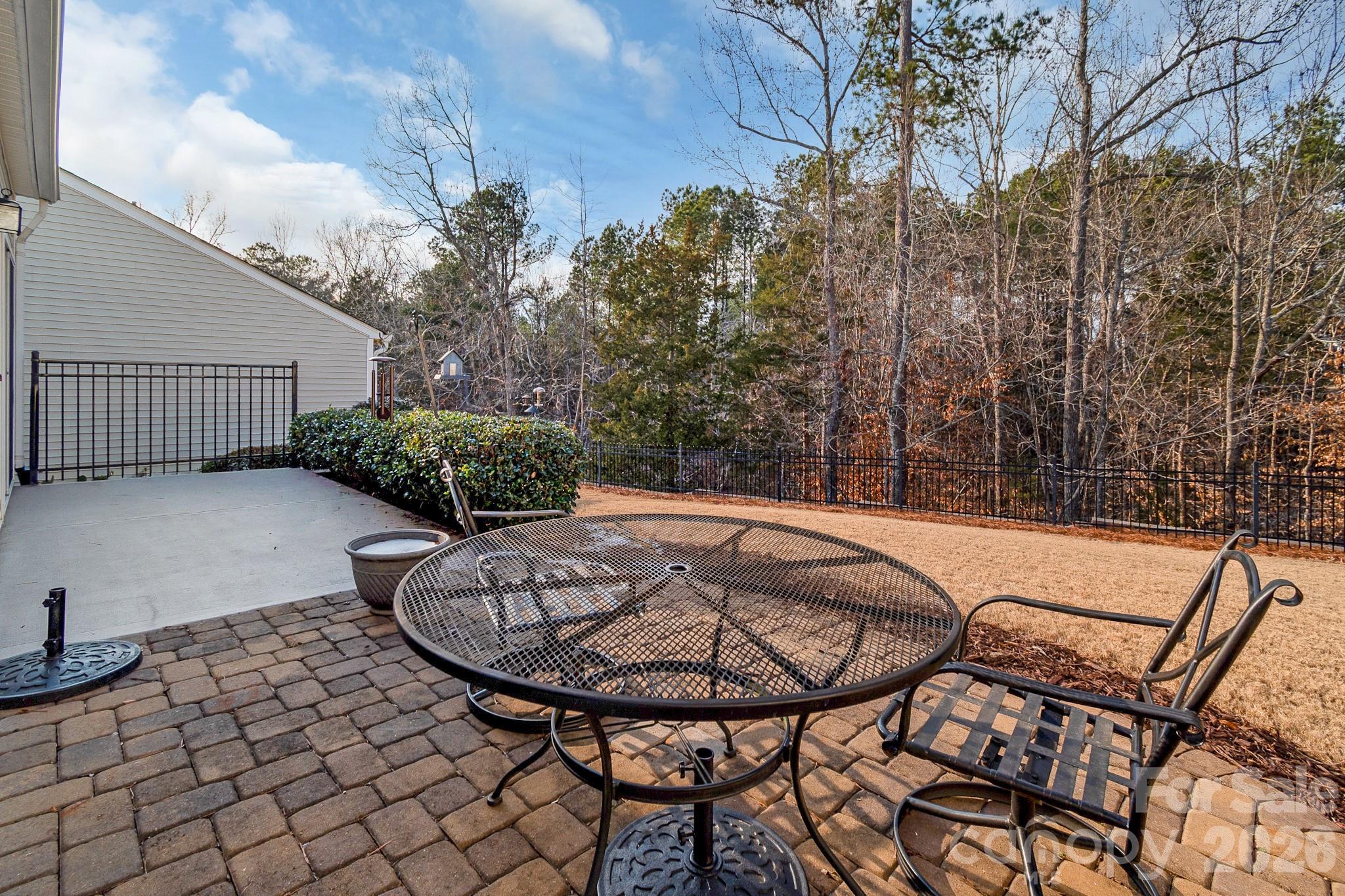 3037 Azalea Drive Fort Mill, SC 29707 - Photo 19 of 24 a view of a chairs and tables in the back yard of the house
