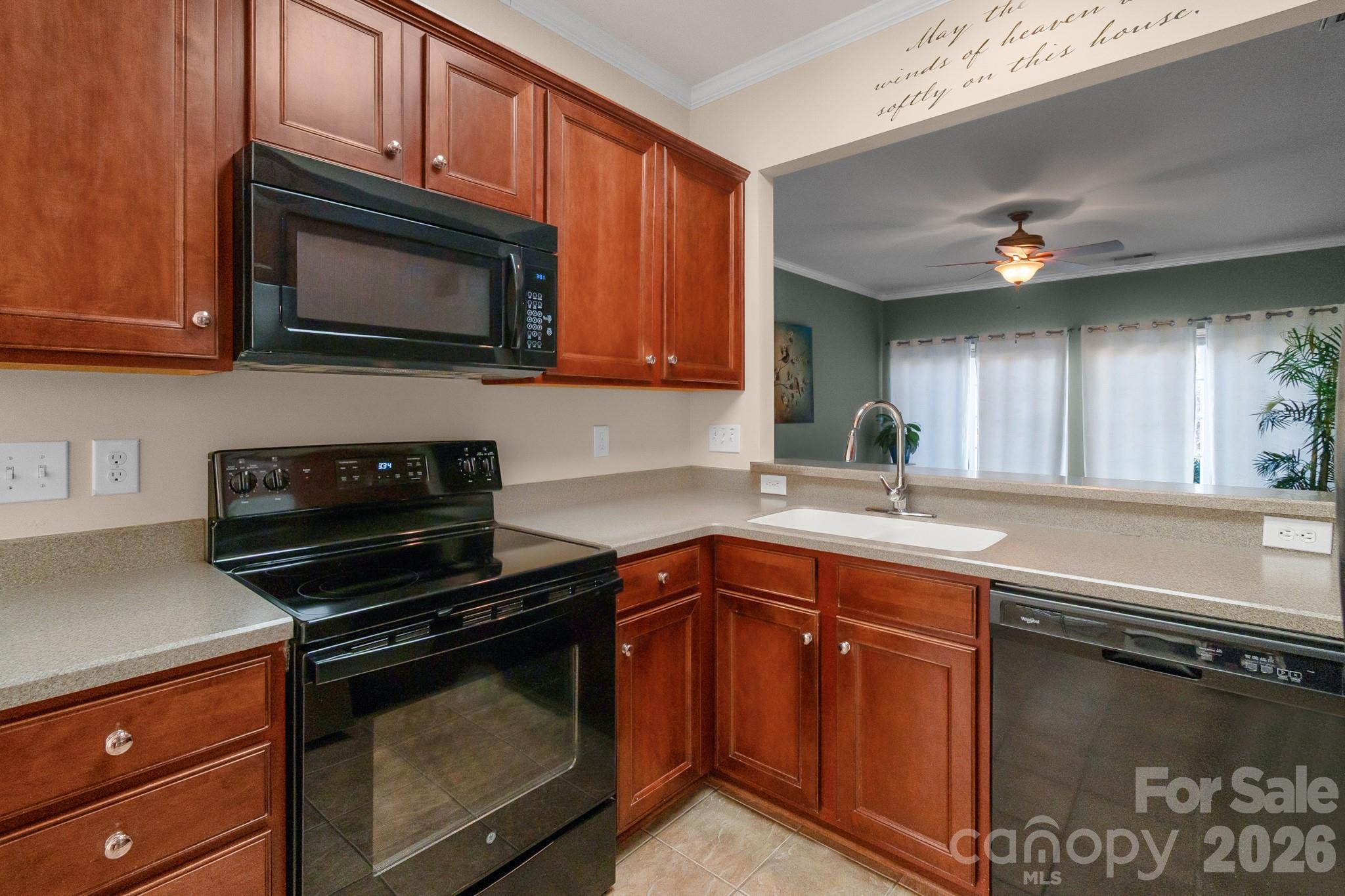 3037 Azalea Drive Fort Mill, SC 29707 - Photo 6 of 24 a kitchen with stainless steel appliances granite countertop a stove microwave and sink