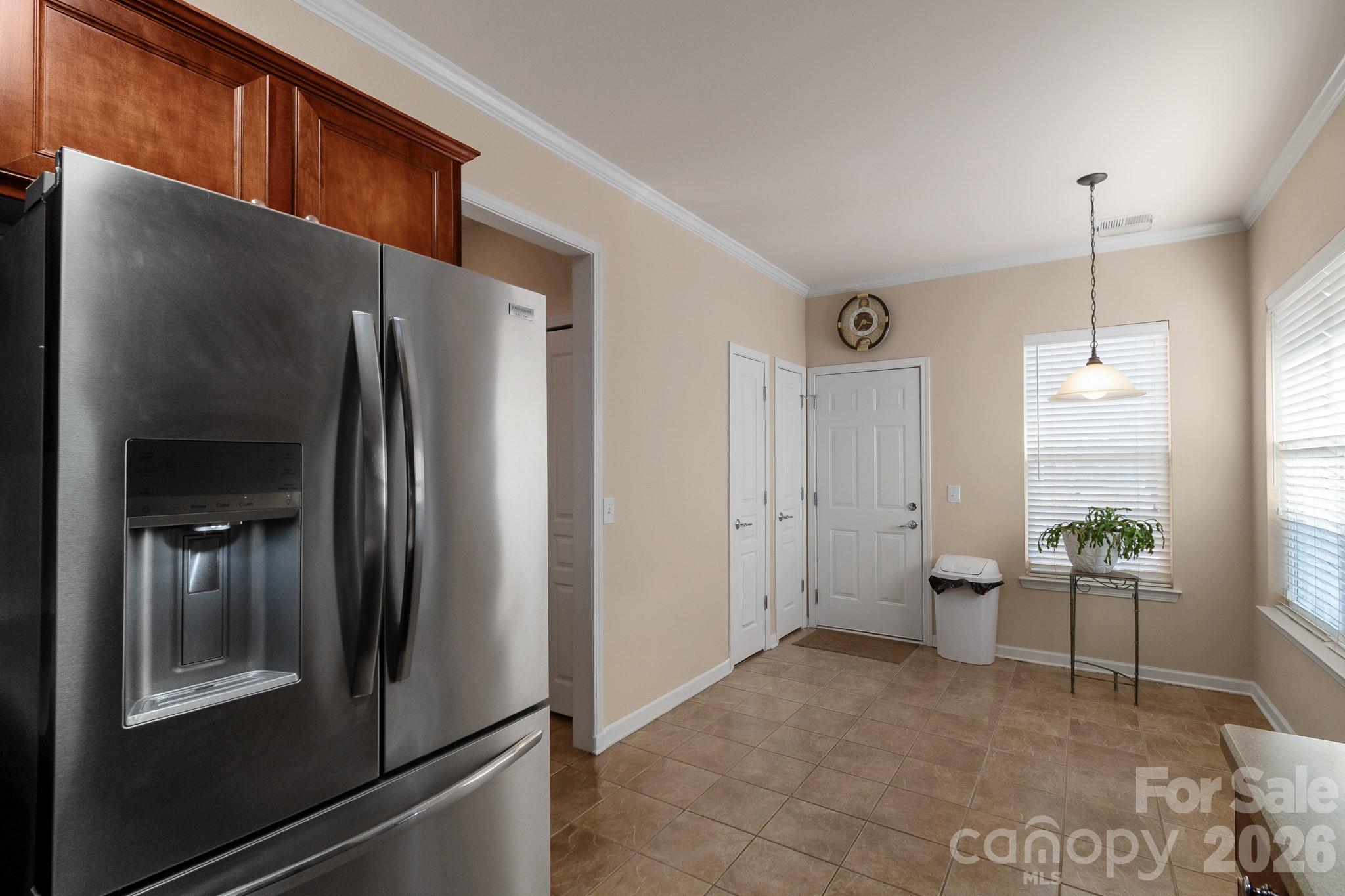 3037 Azalea Drive Fort Mill, SC 29707 - Photo 7 of 24 a kitchen with stainless steel appliances granite countertop a refrigerator and a stove
