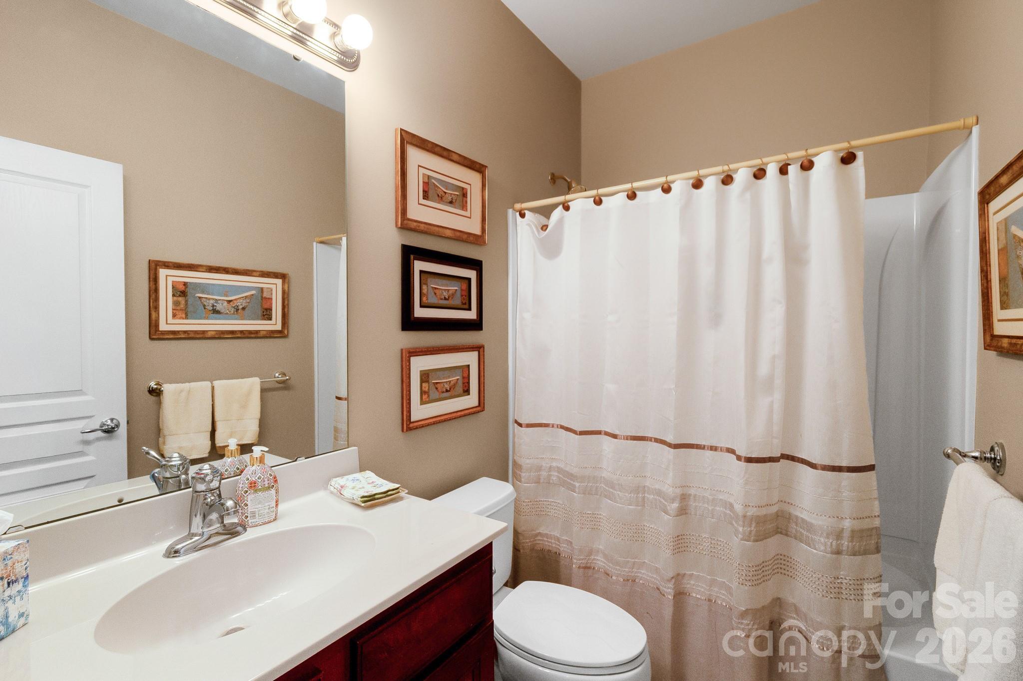 3037 Azalea Drive Fort Mill, SC 29707 - Photo 8 of 24 a bathroom with a sink and a mirror