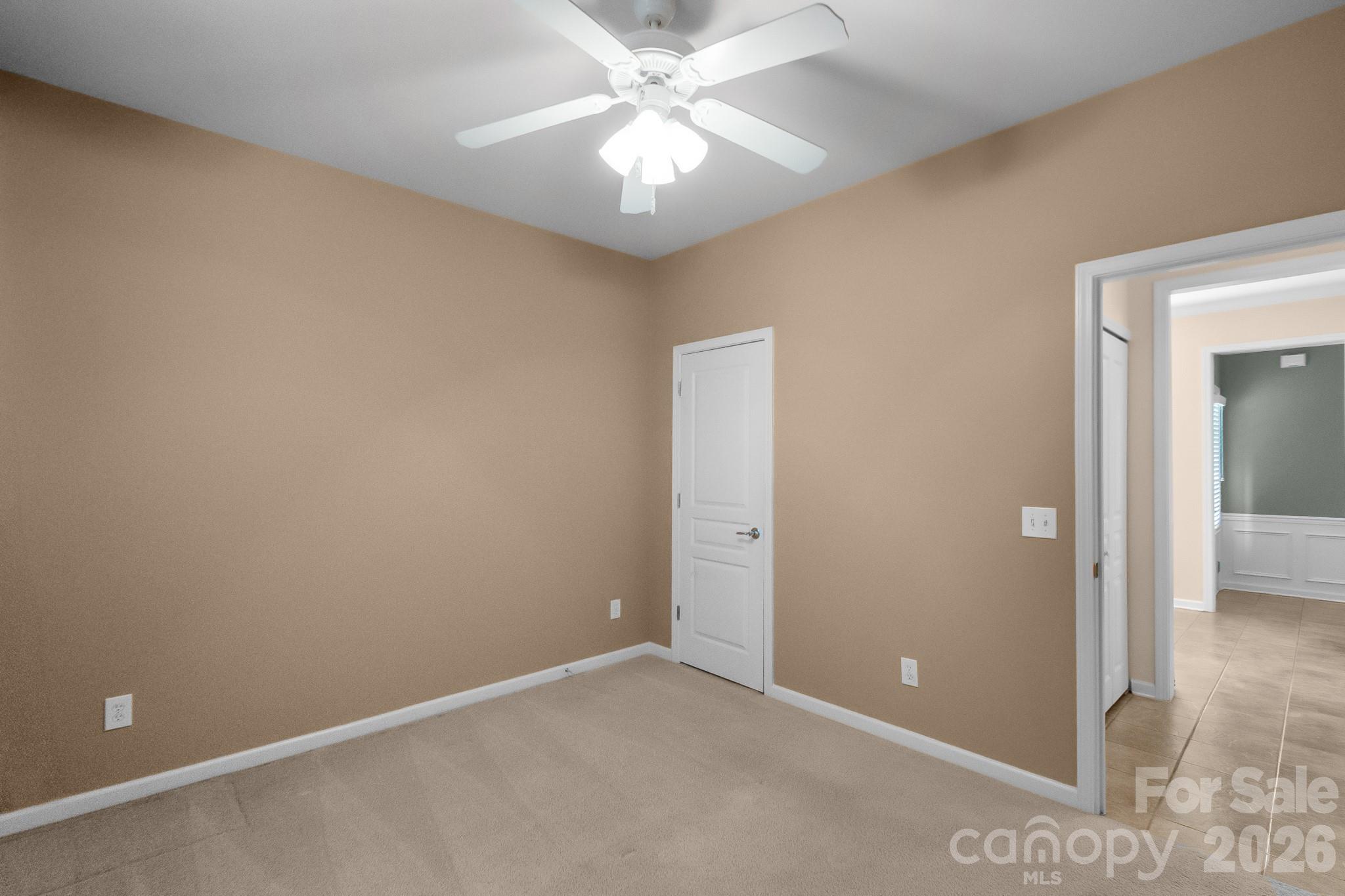 3037 Azalea Drive Fort Mill, SC 29707 - Photo 9 of 24 an empty room with closet and a chandelier fan