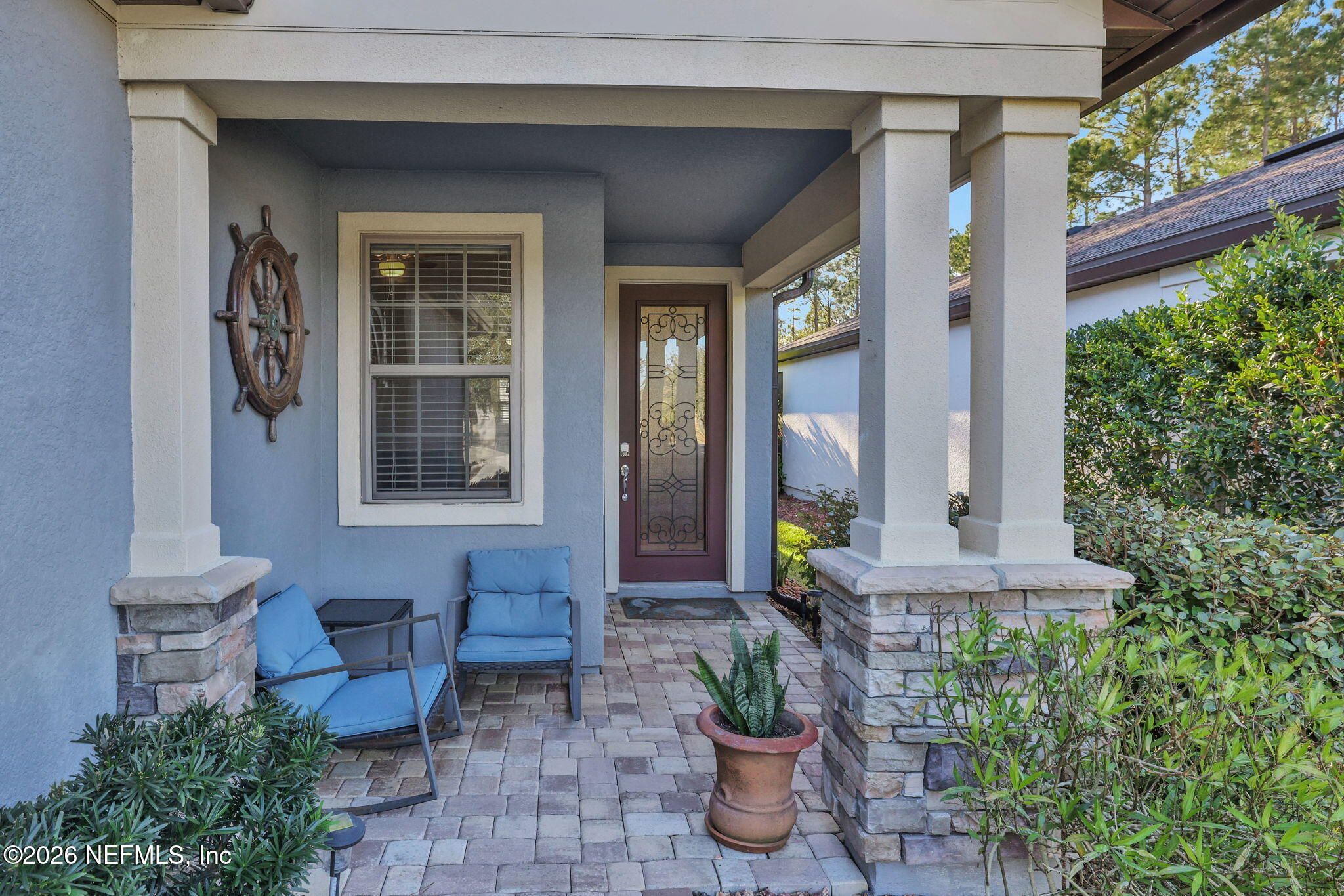 198 Forest Spring Drive Ponte Vedra, FL 32081 - Photo 2 of 56 a front view of a house with outdoor seating and plants
