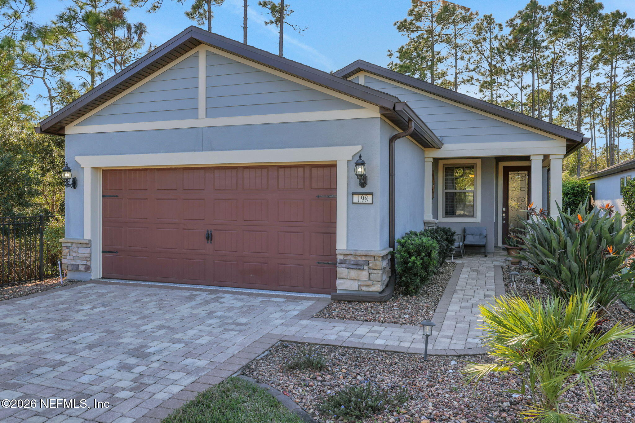 198 Forest Spring Drive Ponte Vedra, FL 32081 - Photo 3 of 56 a front view of house with yard and trees around