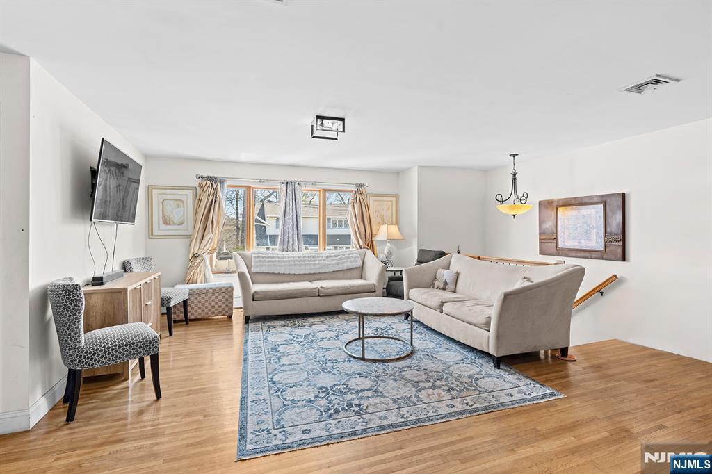 19 Cherry Street Garfield, NJ 07026 - Photo 20 of 43 a living room with furniture and a wooden floor