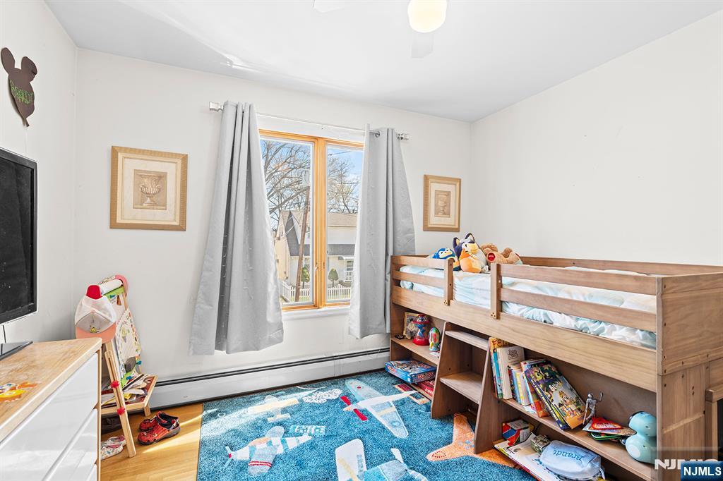 19 Cherry Street Garfield, NJ 07026 - Photo 22 of 43 a bedroom with furniture and a window