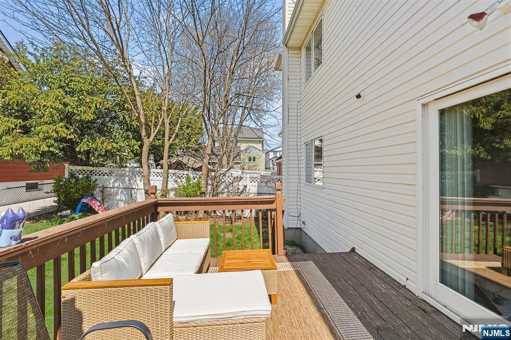 19 Cherry Street Garfield, NJ 07026 - Photo 36 of 43 a view of balcony with wooden floor and outdoor seating