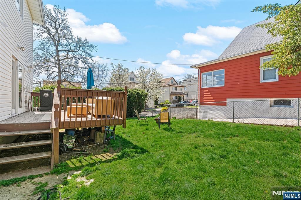 19 Cherry Street Garfield, NJ 07026 - Photo 37 of 43 a backyard of a house with table and chairs