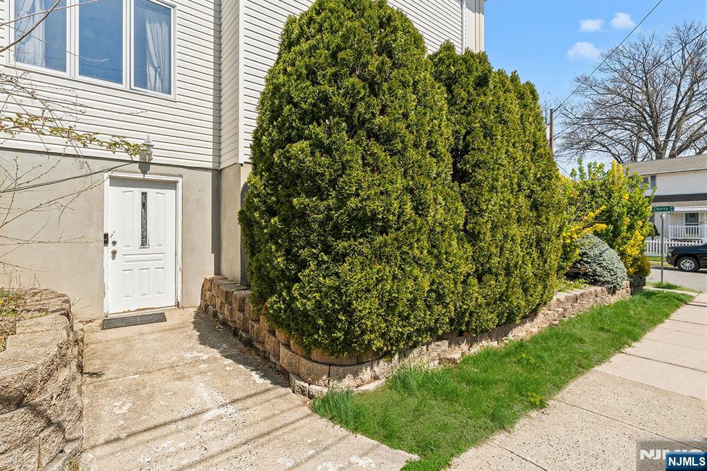 19 Cherry Street Garfield, NJ 07026 - Photo 39 of 43 a backyard of a house with lots of green space