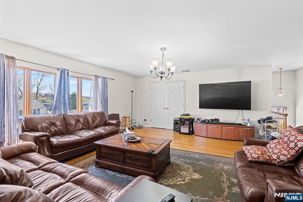 19 Cherry Street Garfield, NJ 07026 - Photo 6 of 43 a living room with furniture and a flat screen tv
