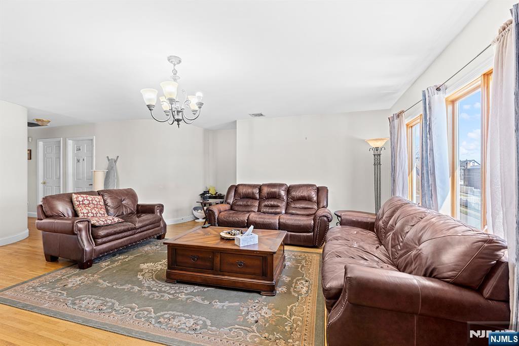 19 Cherry Street Garfield, NJ 07026 - Photo 7 of 43 a living room with furniture and a large window