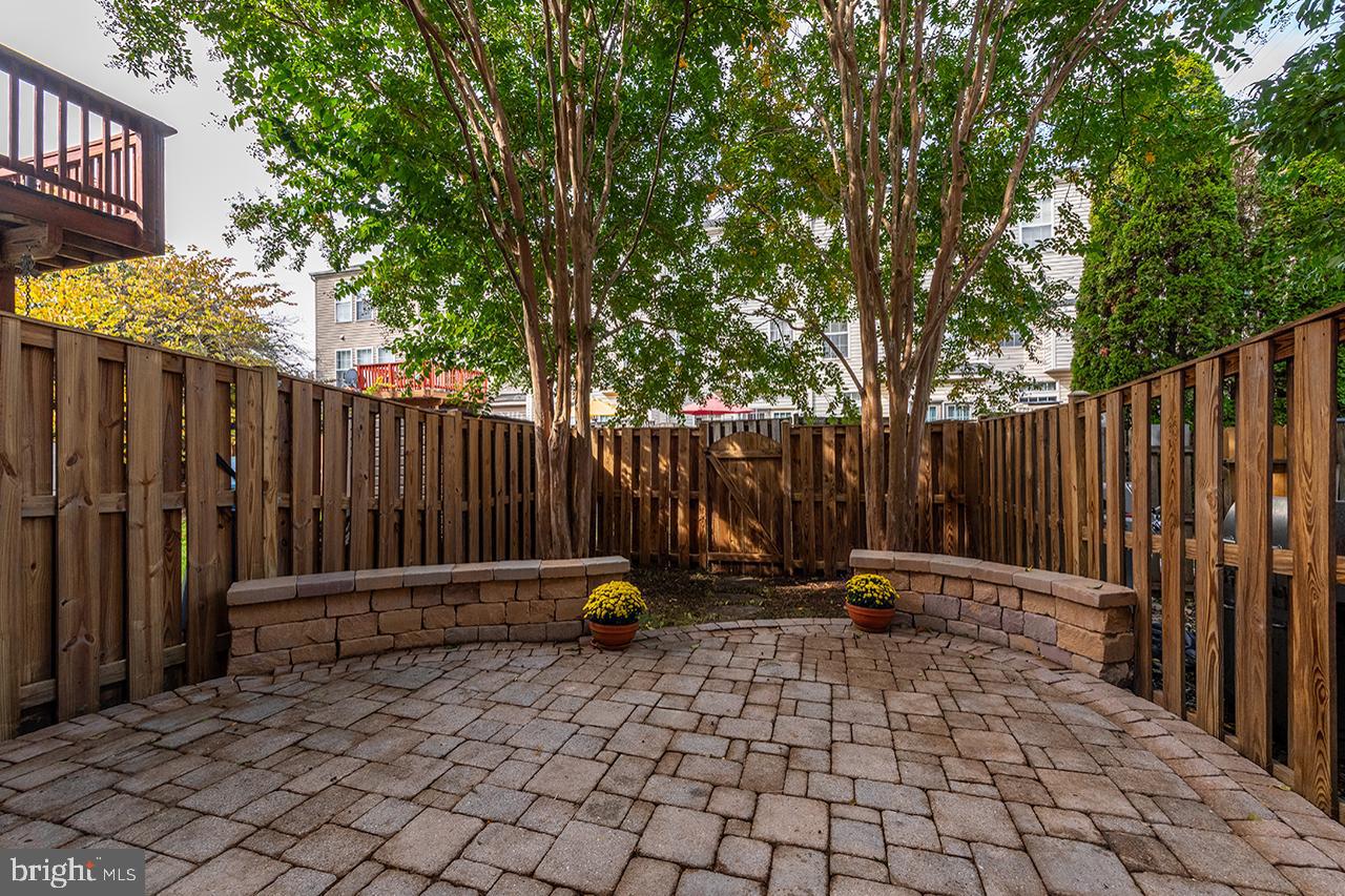 21081 Bitterroot Terrace Ashburn, VA 20147 - Photo 2 of 25 Custom brick patio off kitchen.