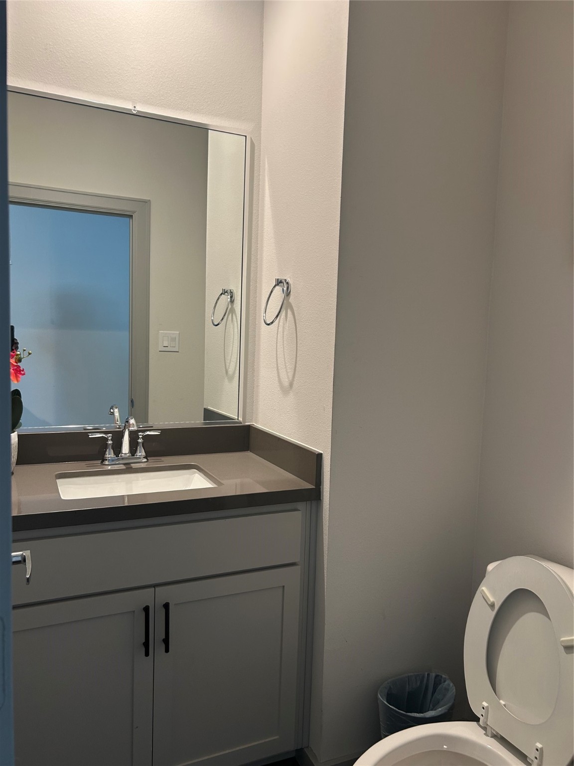 805 Emile Street Houston, TX 77020 - Photo 5 of 7 a bathroom with a granite countertop toilet sink and mirror