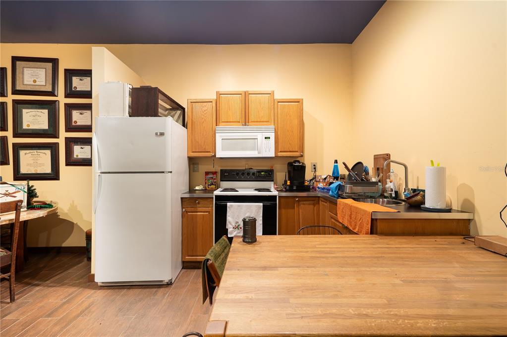 6924 Valrie Lane Riverview, FL 33569 - Photo 13 of 29 a kitchen with a refrigerator and a stove
