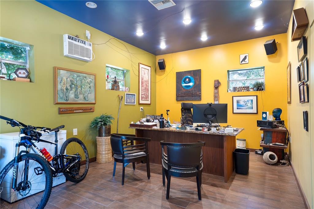 6924 Valrie Lane Riverview, FL 33569 - Photo 17 of 29 a view of a workspace with furniture and wooden floor