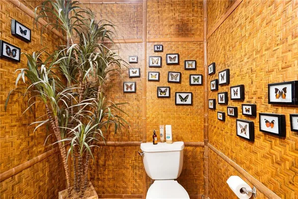 a bathroom with a toilet sink and shower