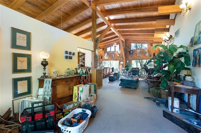 a living room with furniture garage and a wooden floor