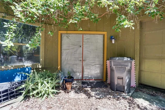 a backyard of a house with yard and outdoor seating