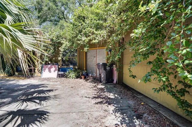 a view of a backyard with a tree