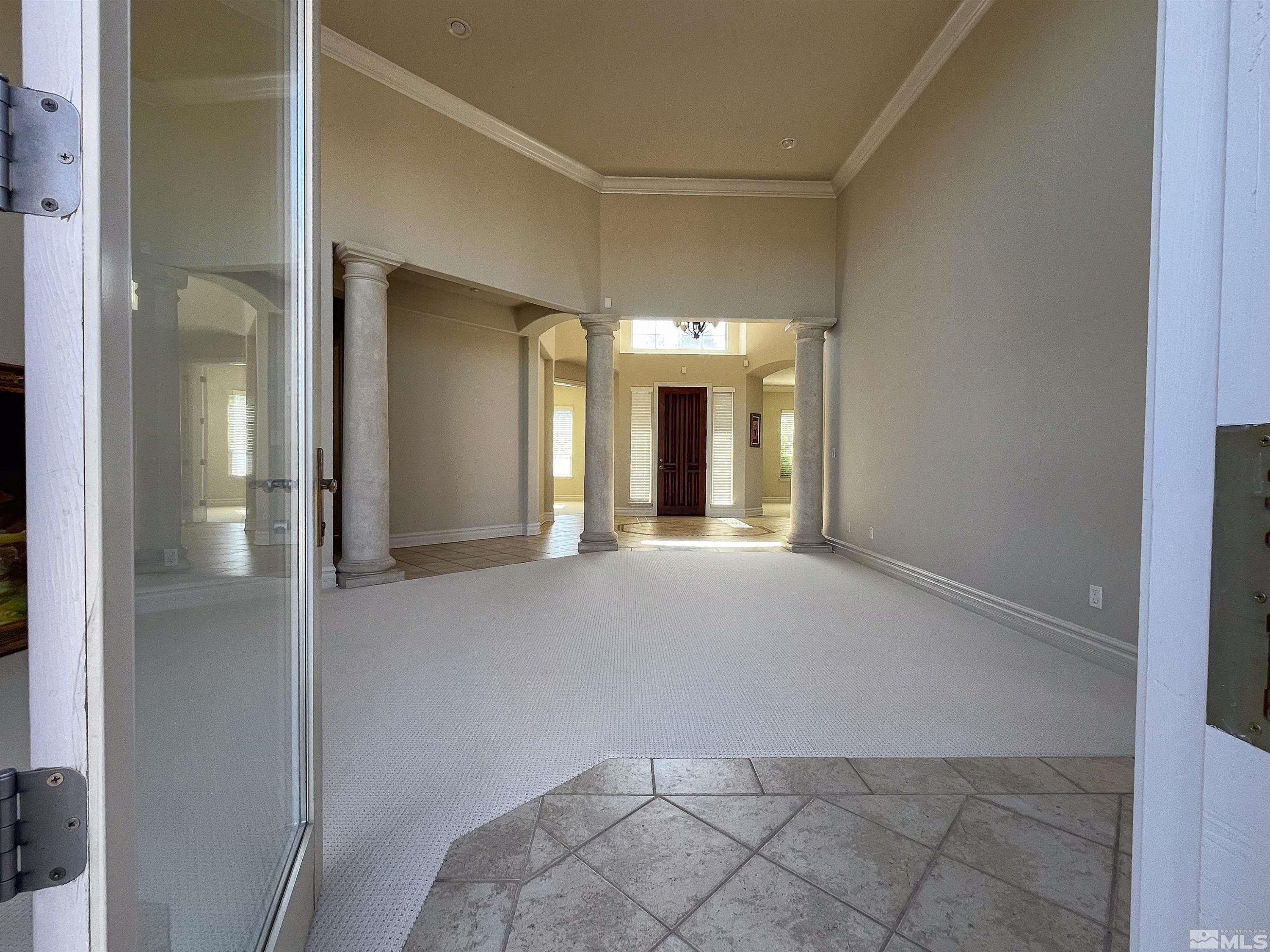 4875 Mountainshyre Road Reno, NV 89519 - Photo 5 of 13 an empty room with windows and entrance