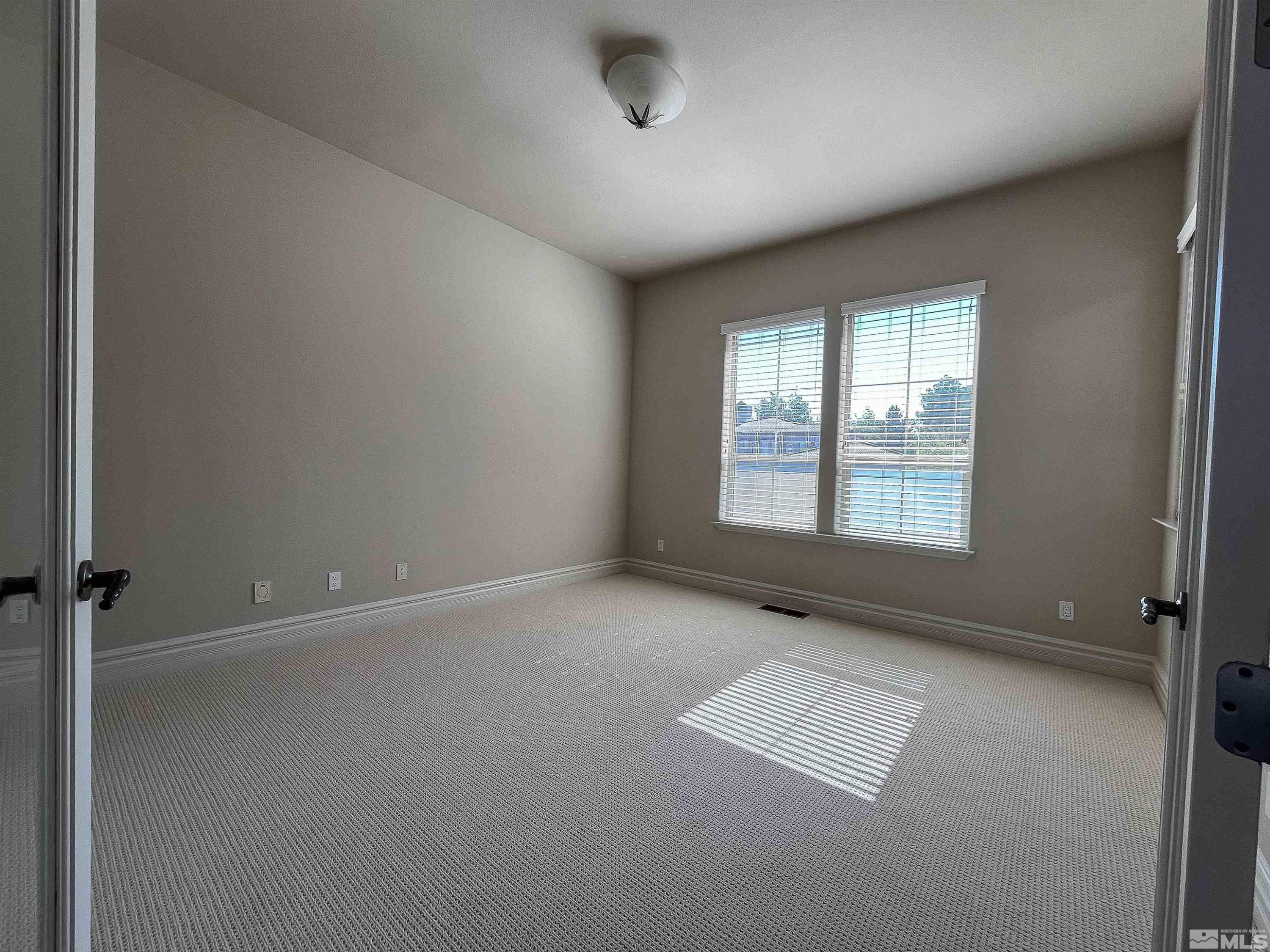 4875 Mountainshyre Road Reno, NV 89519 - Photo 7 of 13 an empty room with windows