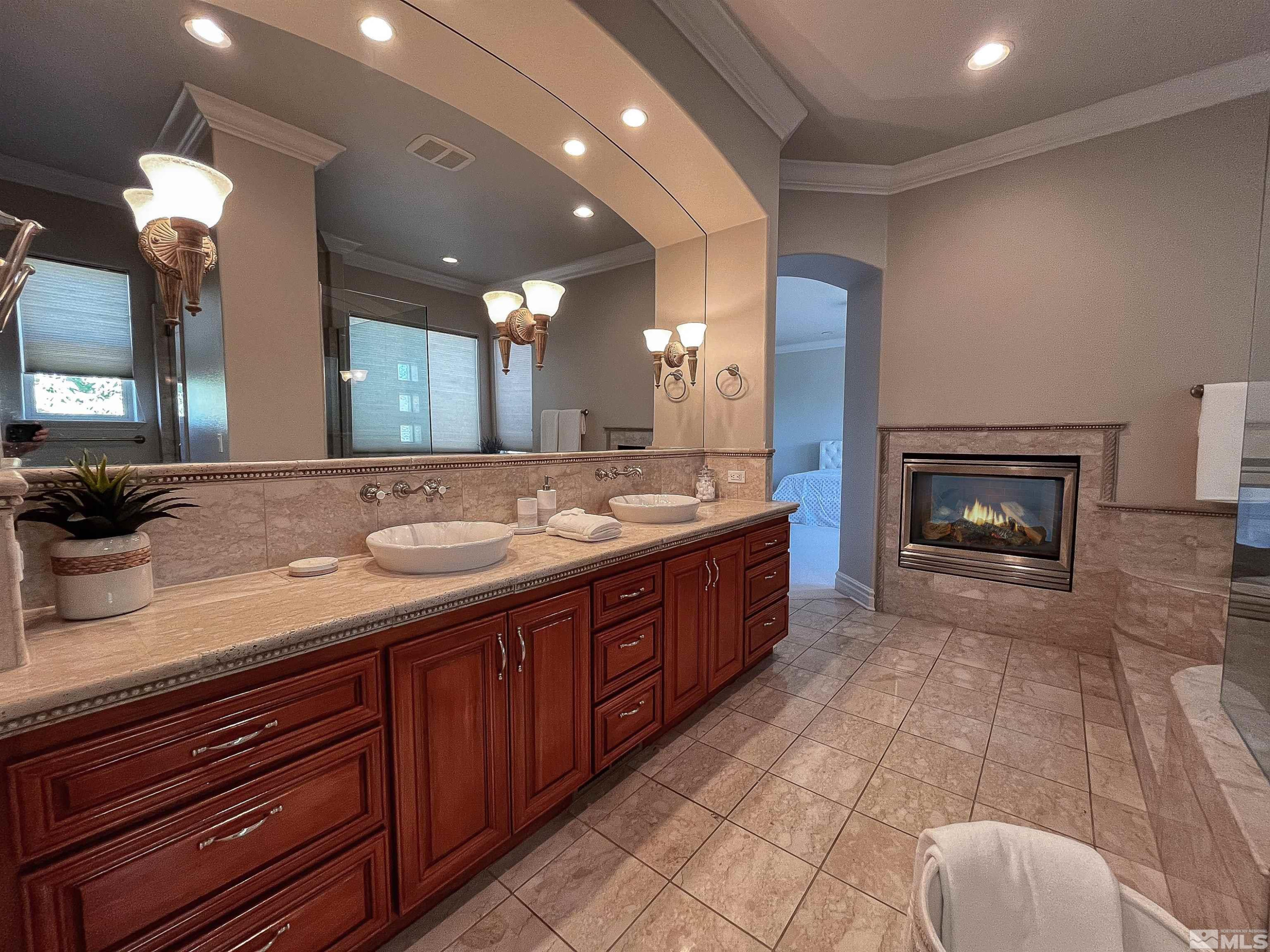 4875 Mountainshyre Road Reno, NV 89519 - Photo 9 of 13 a bathroom with a sink double vanity and a mirror