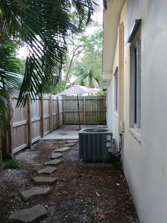 a backyard of a house with lots of green space