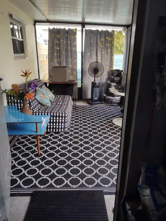 a view of a living room and wooden floor