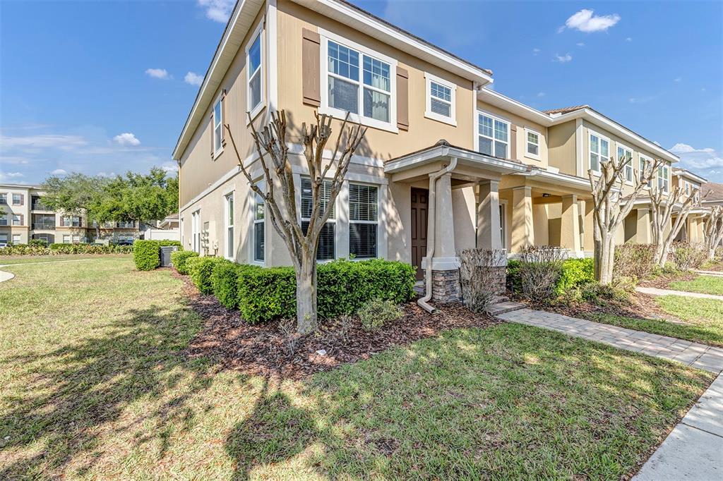 7644 Ripplepointe Way Windermere, FL 34786 - Photo 2 of 52 a view of a brick building next to a yard