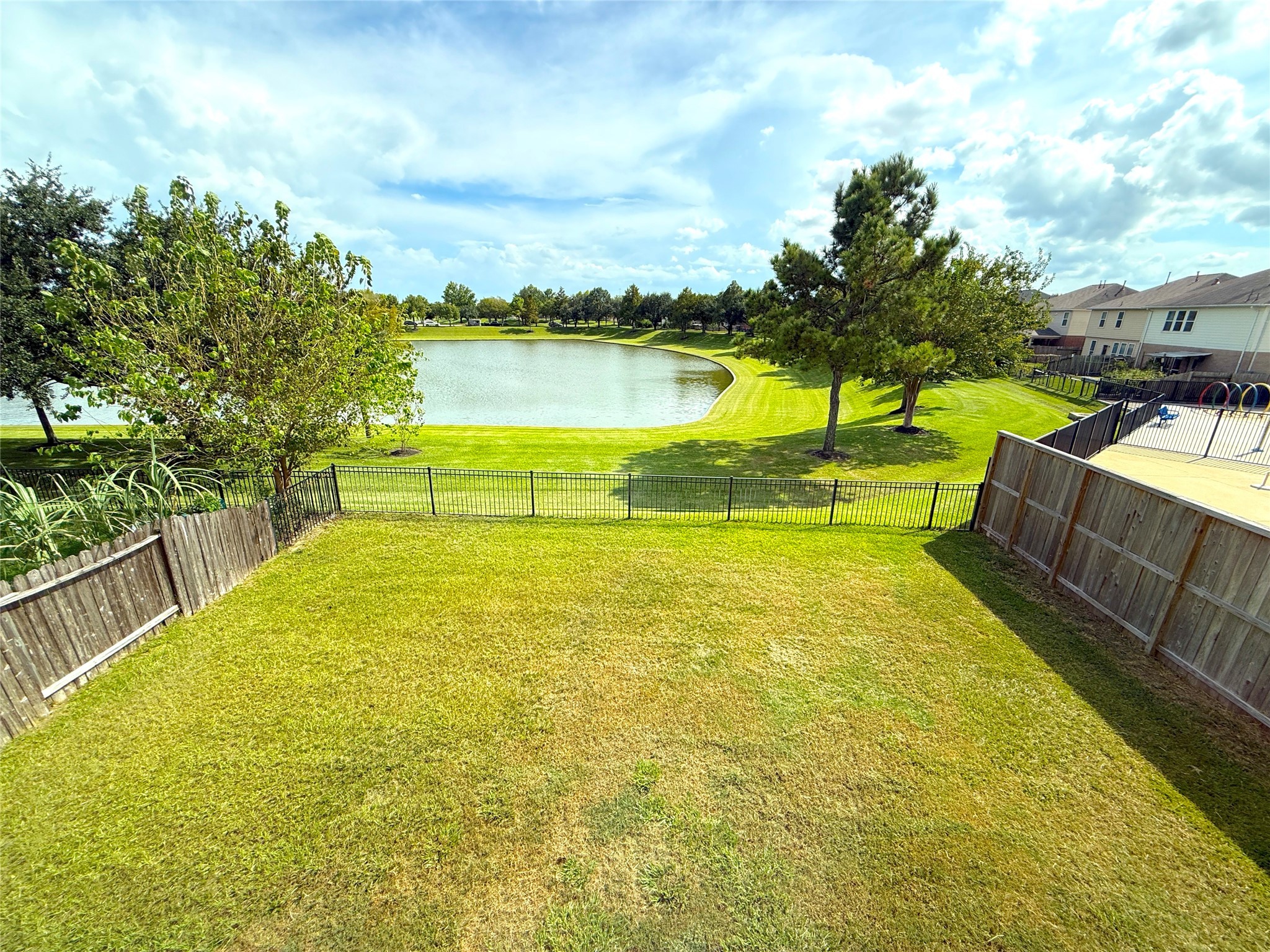 19535 Hardwood Ridge Trail Cypress, TX 77429 - Photo 14 of 15 a view of a swimming pool with an outdoor seating and a garden