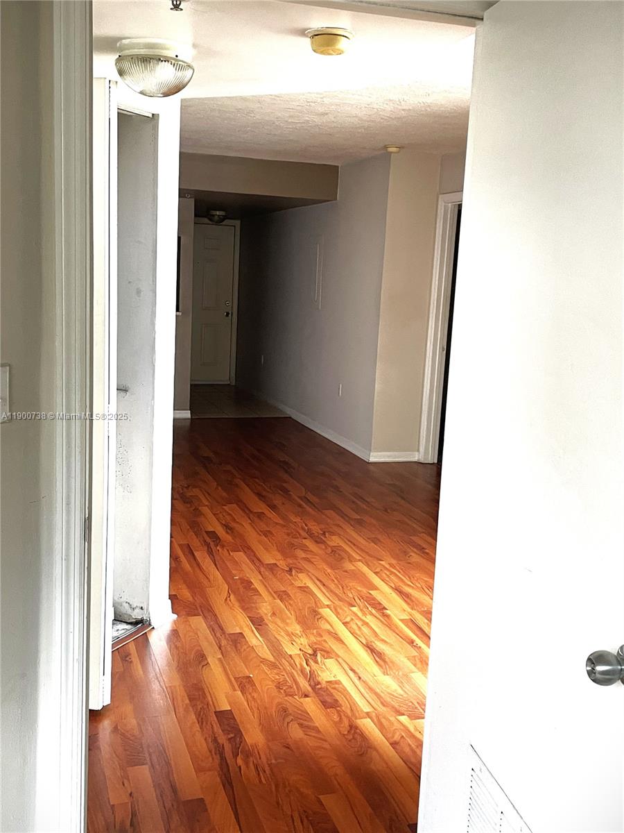 102 Southwest 6th Avenue, Unit 501 Miami, FL 33130 - Photo 9 of 18 a view of hallway with wooden floor
