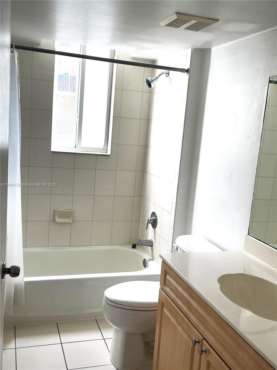 102 Southwest 6th Avenue, Unit 501 Miami, FL 33130 - Photo 10 of 18 a bathroom with a sink a toilet and a bathtub