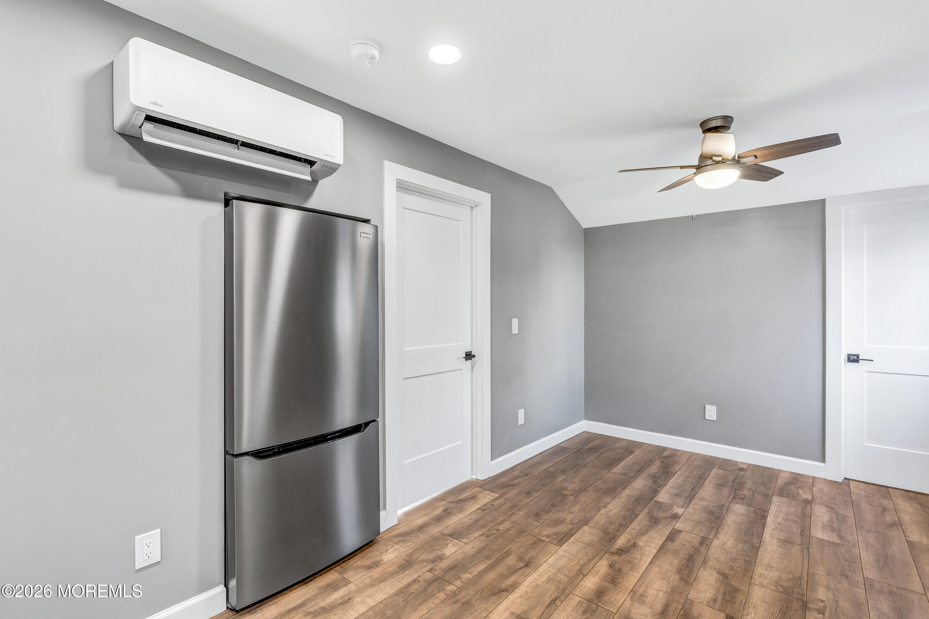 32 Chestnut Street Waretown, NJ 08758 - Photo 16 of 35 a view of a kitchen with a refrigerator and a ceiling fan