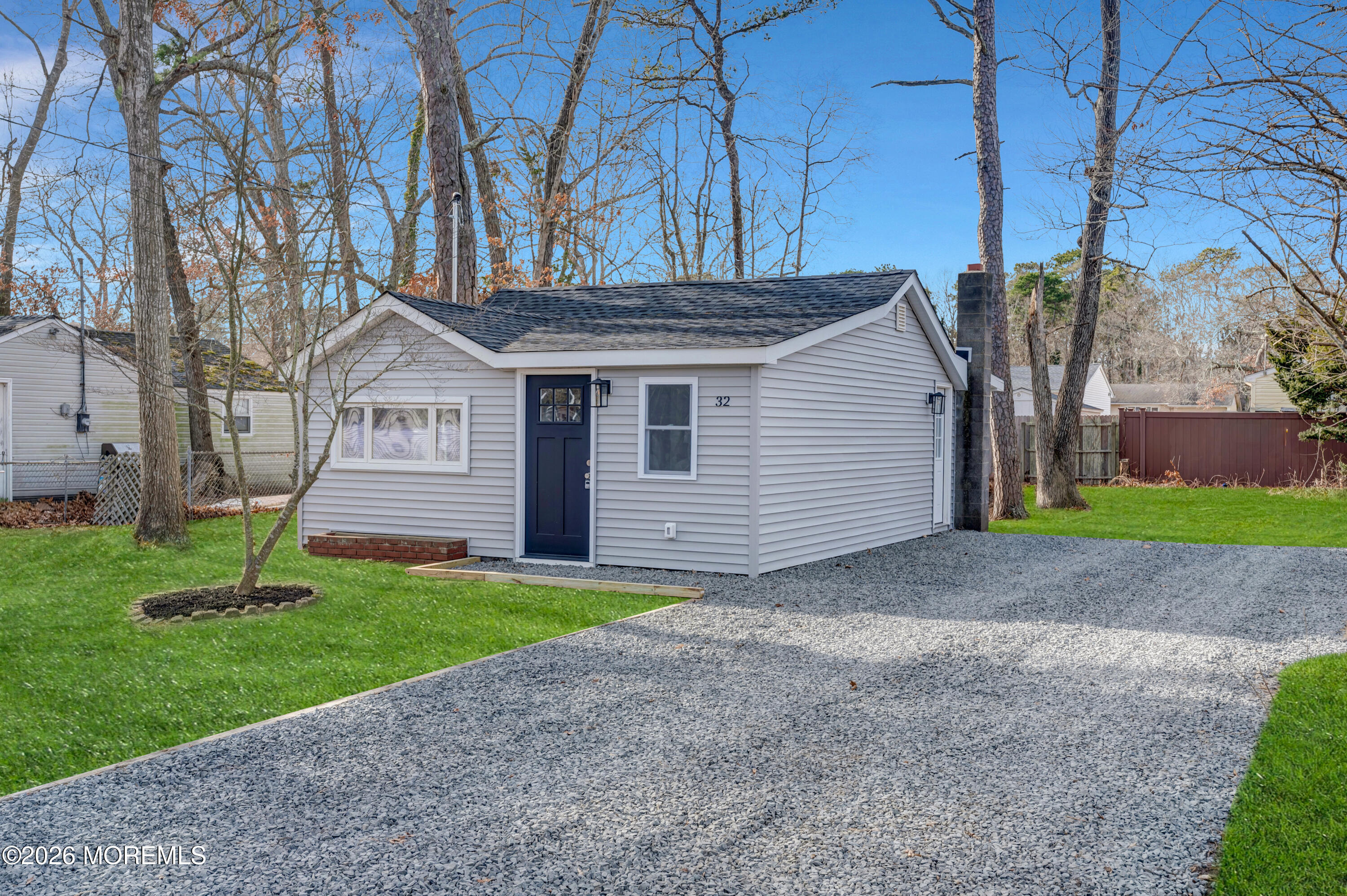 32 Chestnut Street Waretown, NJ 08758 - Photo 2 of 35 a front view of house with yard and green space