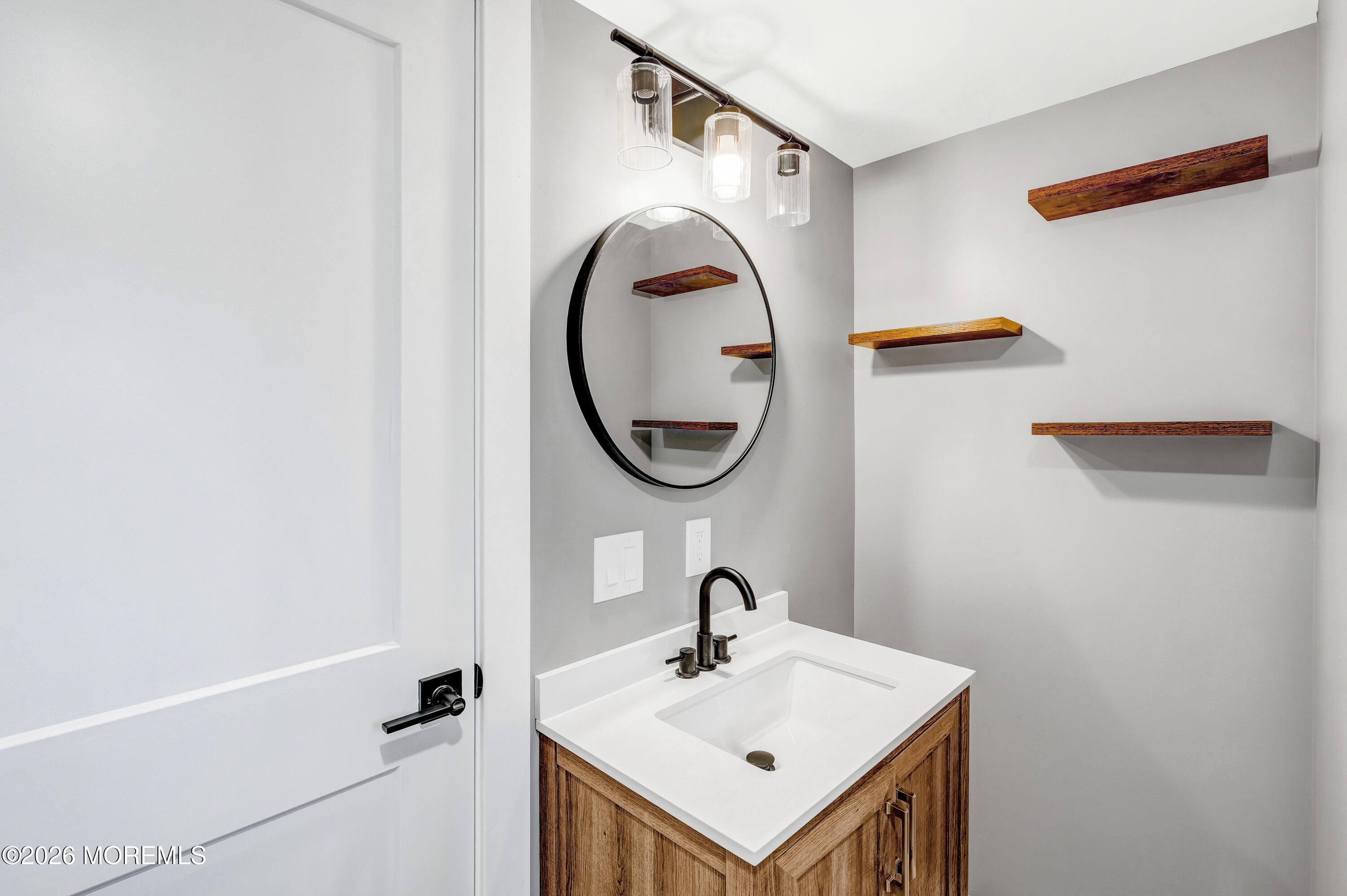 32 Chestnut Street Waretown, NJ 08758 - Photo 22 of 35 a bathroom with a sink and a mirror